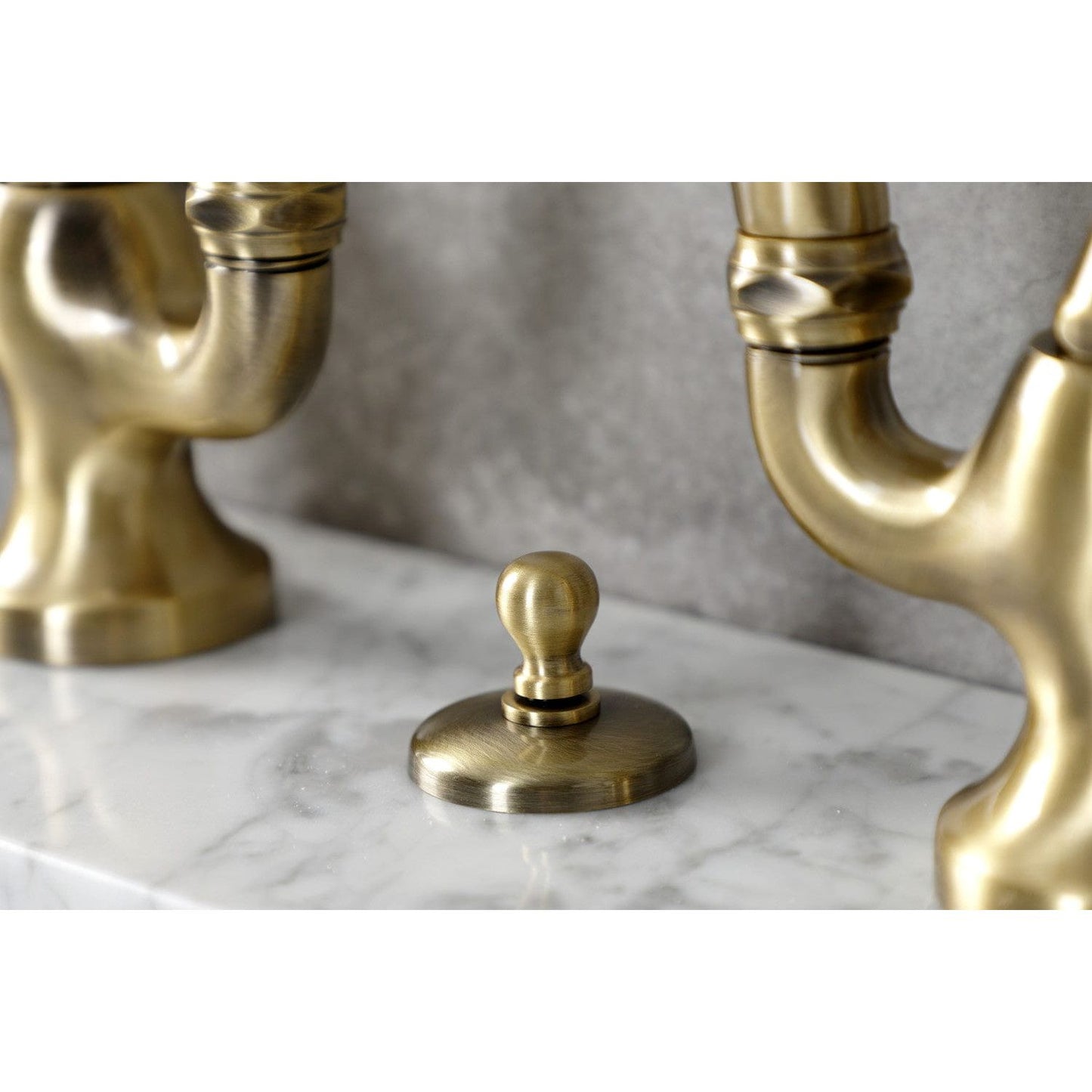 Kingston Brass Kingston Brass Tudor Bridge Bathroom Faucet with Brass Pop-Up, Antique Brass KS7993TAL