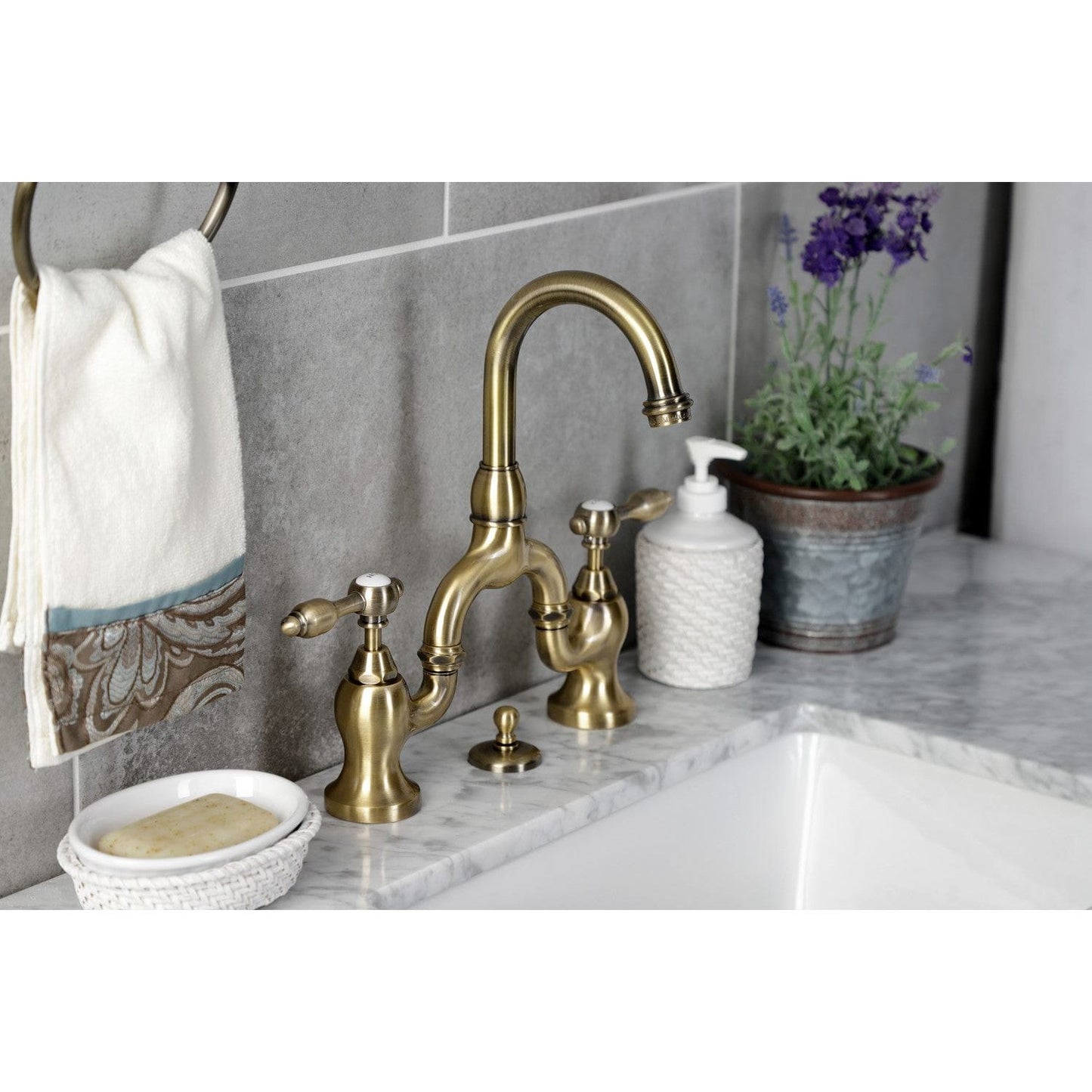 Kingston Brass Kingston Brass Tudor Bridge Bathroom Faucet with Brass Pop-Up, Antique Brass KS7993TAL