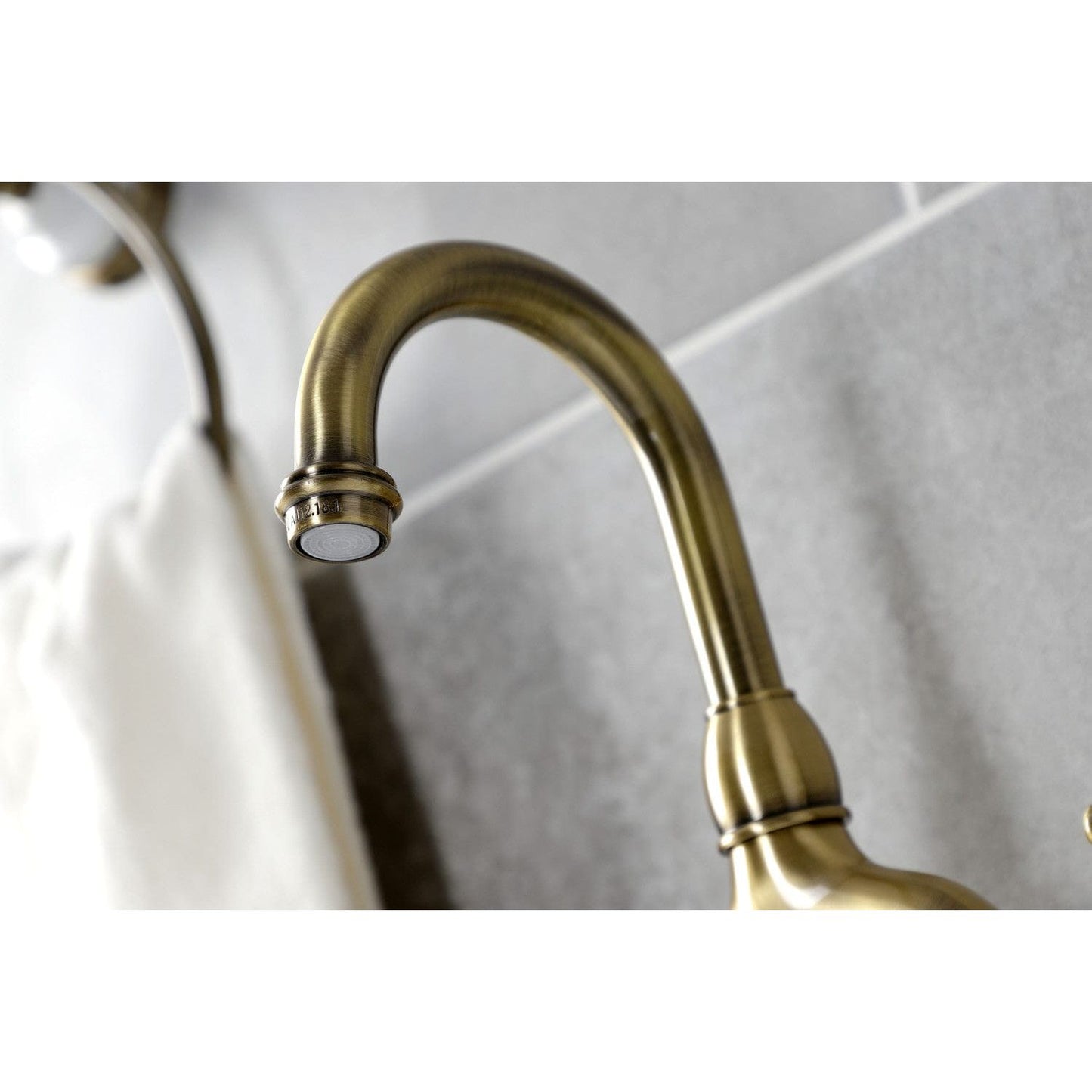 Kingston Brass Kingston Brass Tudor Bridge Bathroom Faucet with Brass Pop-Up, Antique Brass KS7993TAL